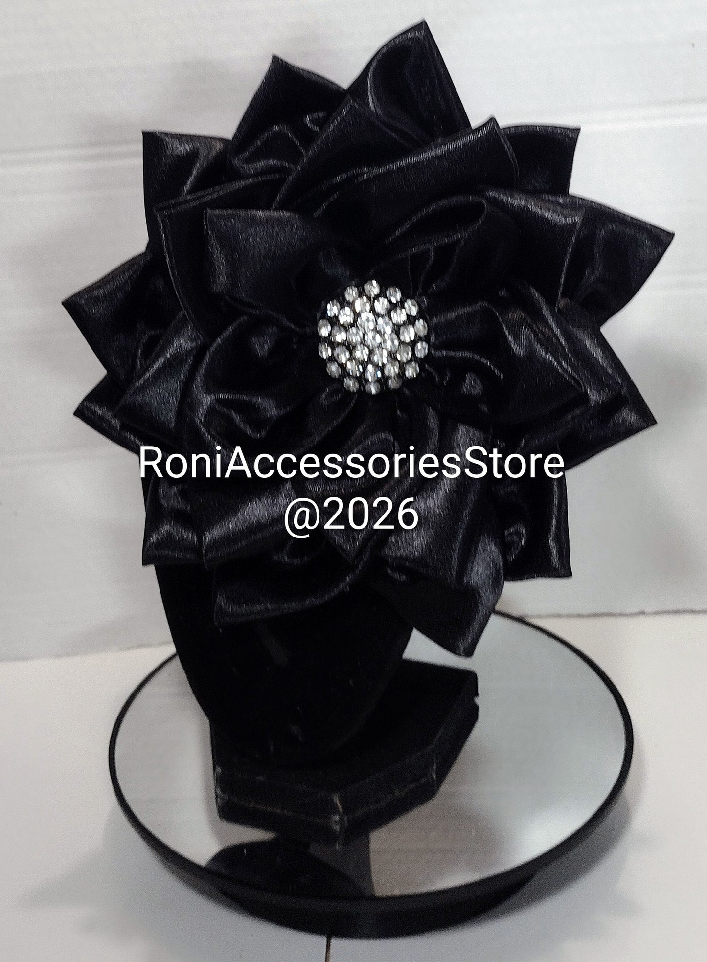Black satin floral corsage pin with a decorative lapel flower designed for formal accessories by Roni Accessories Store